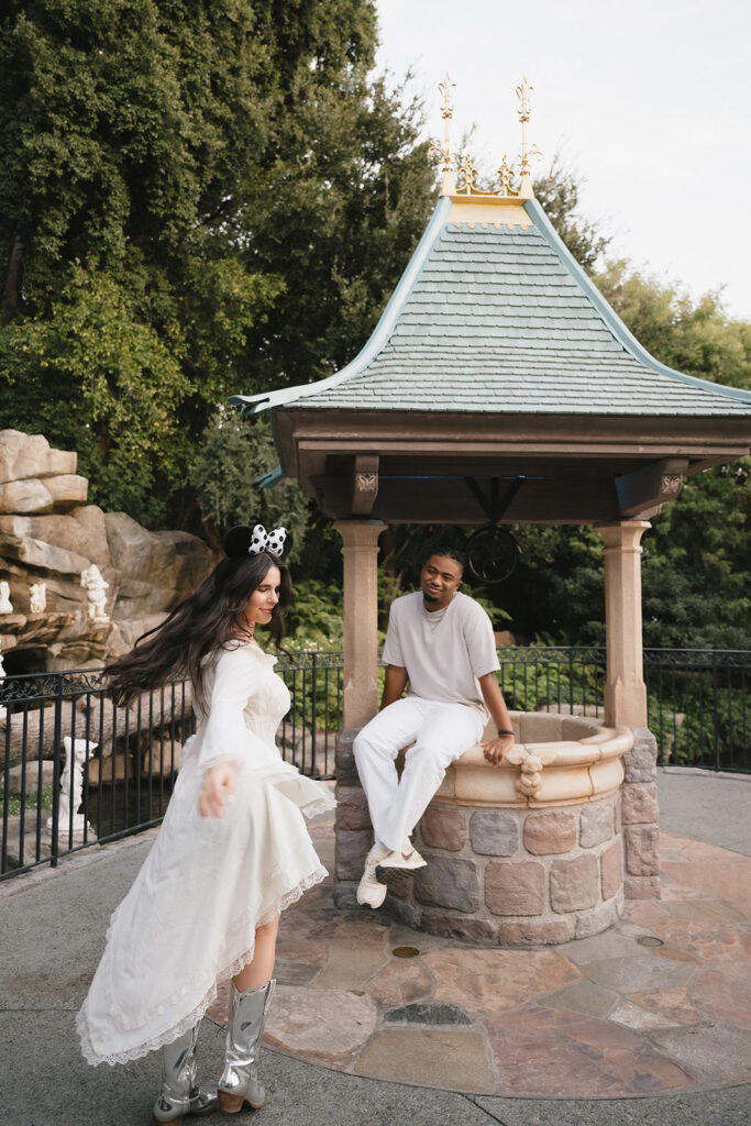 couple dancing during their photoshoot at disney 