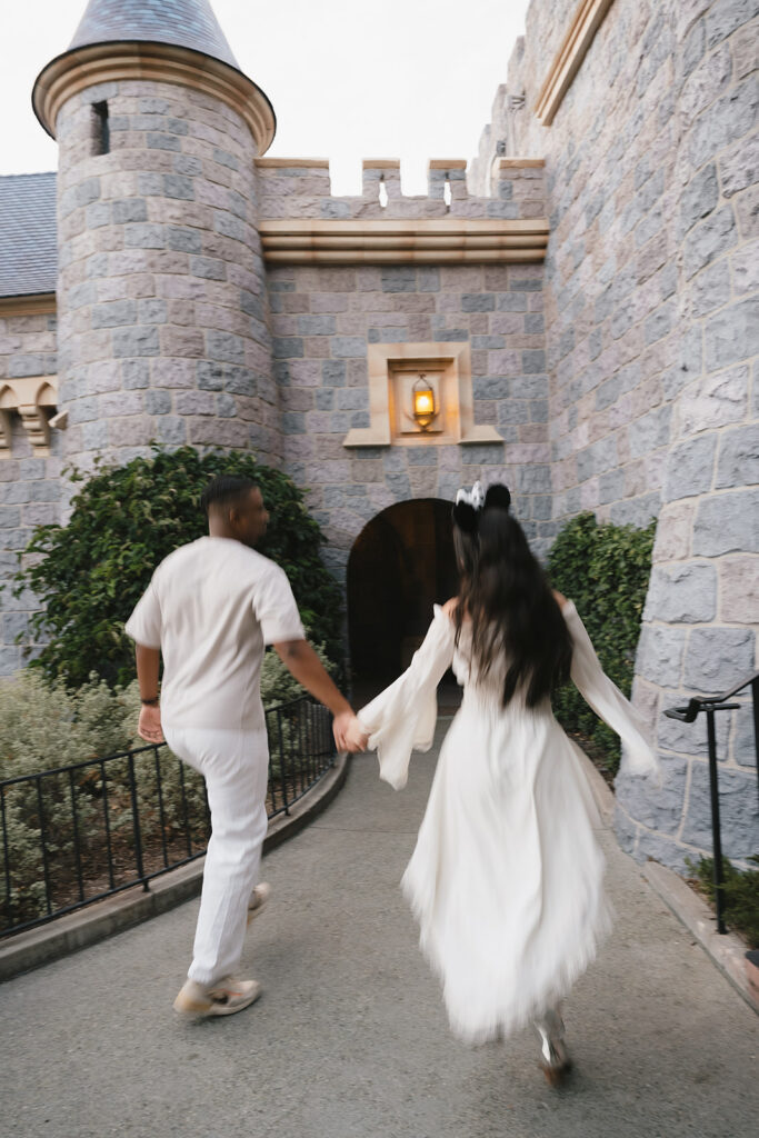 couple walking around disneyland 