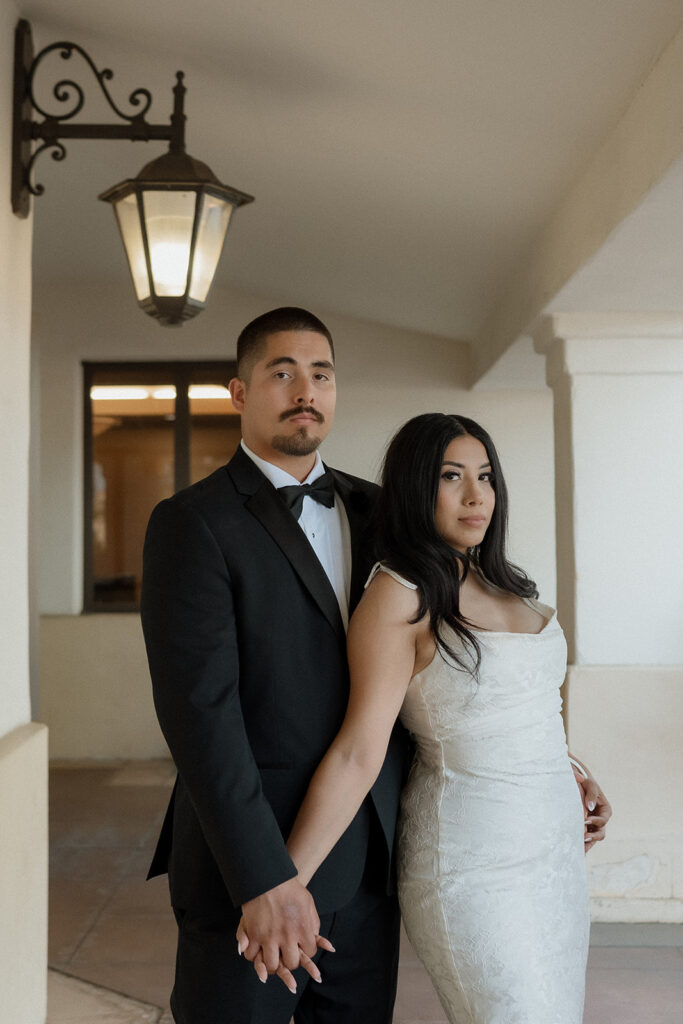 bride and groom looking at the camera