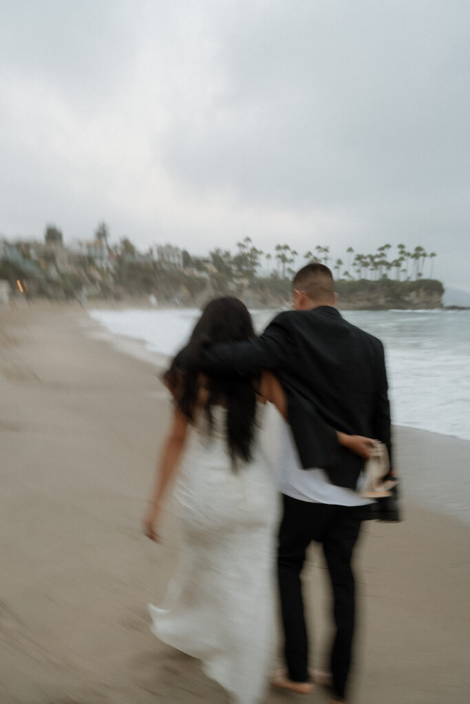 couple walking around laguna beach 