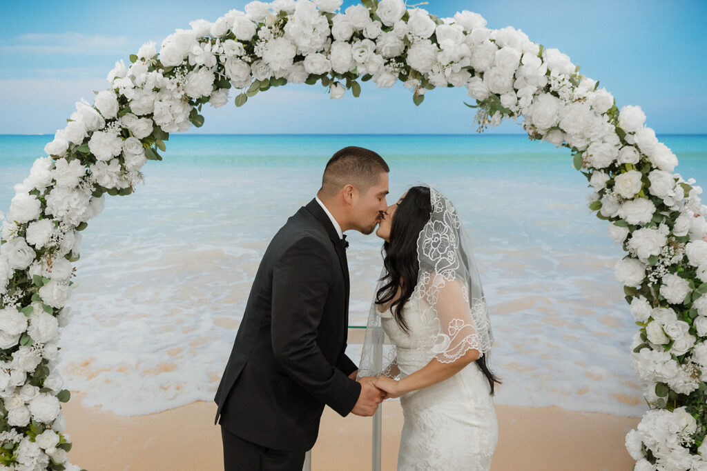 couple kissing after their wedding ceremony 