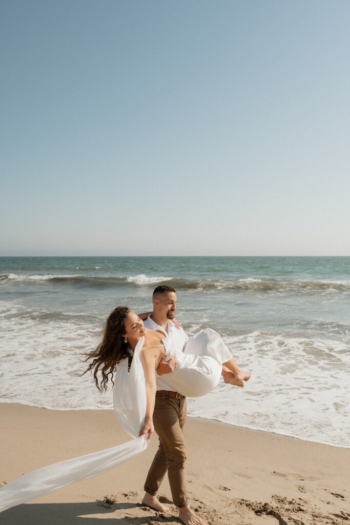 couple walking around the beach 