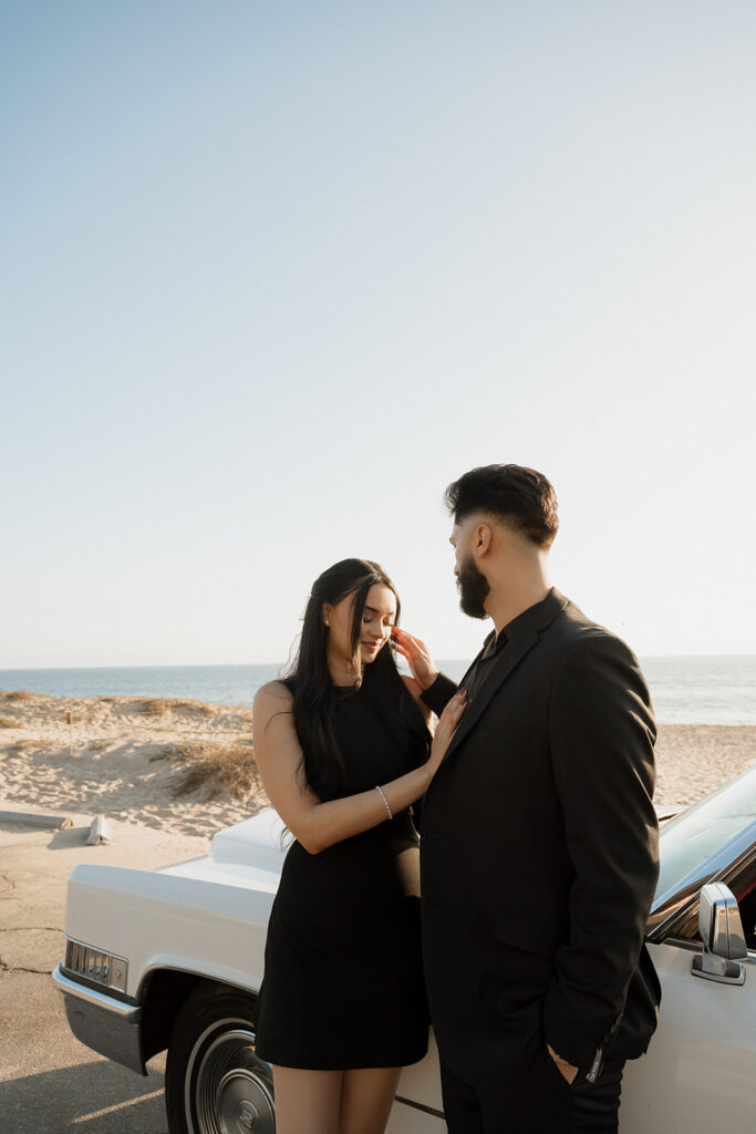 couple smiling at each other during their romantic engagement session