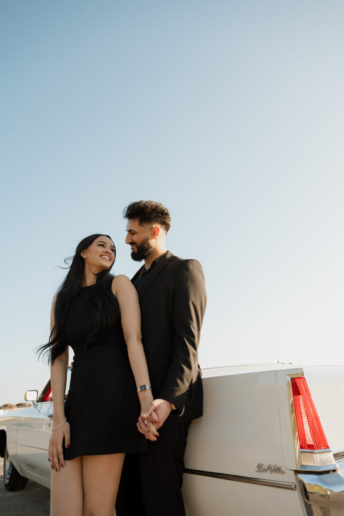 cute couple laughing with each other during their photoshoot