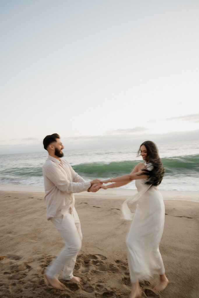 couple dancing at the beach 