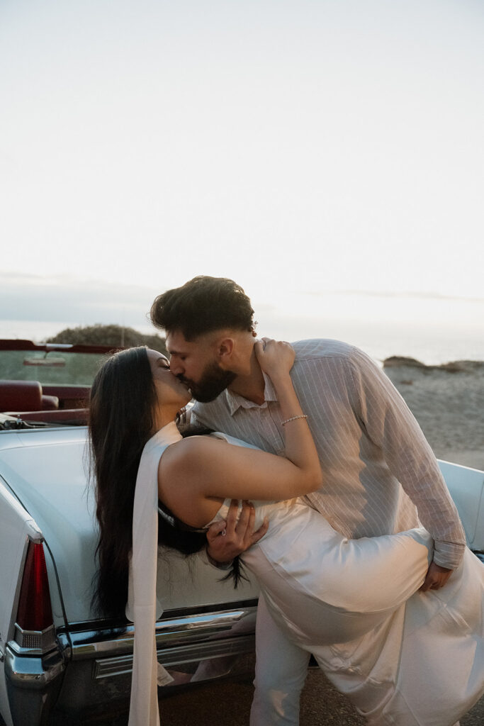 newly engaged couple kissing during their photoshoot