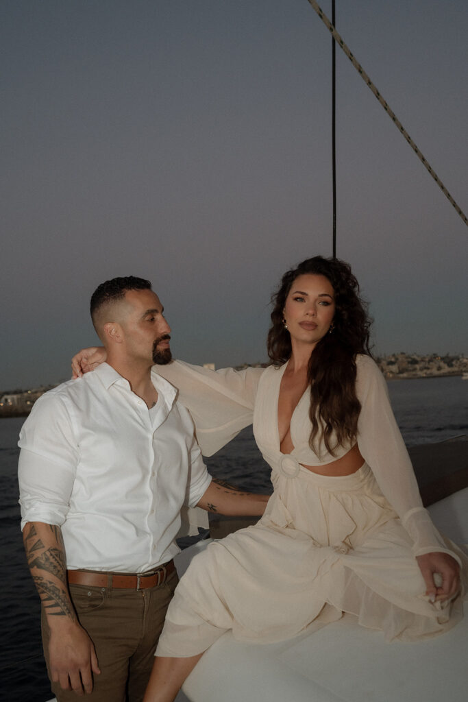 couple on a sail boat after their elopement