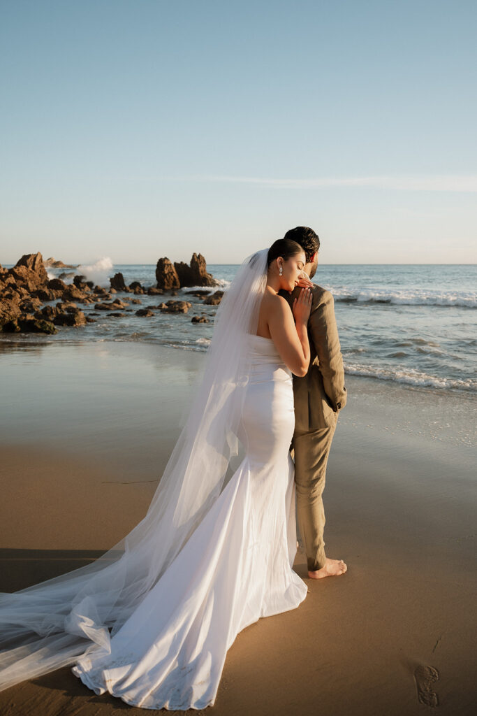 bride resting her head on the grooms shoulder 