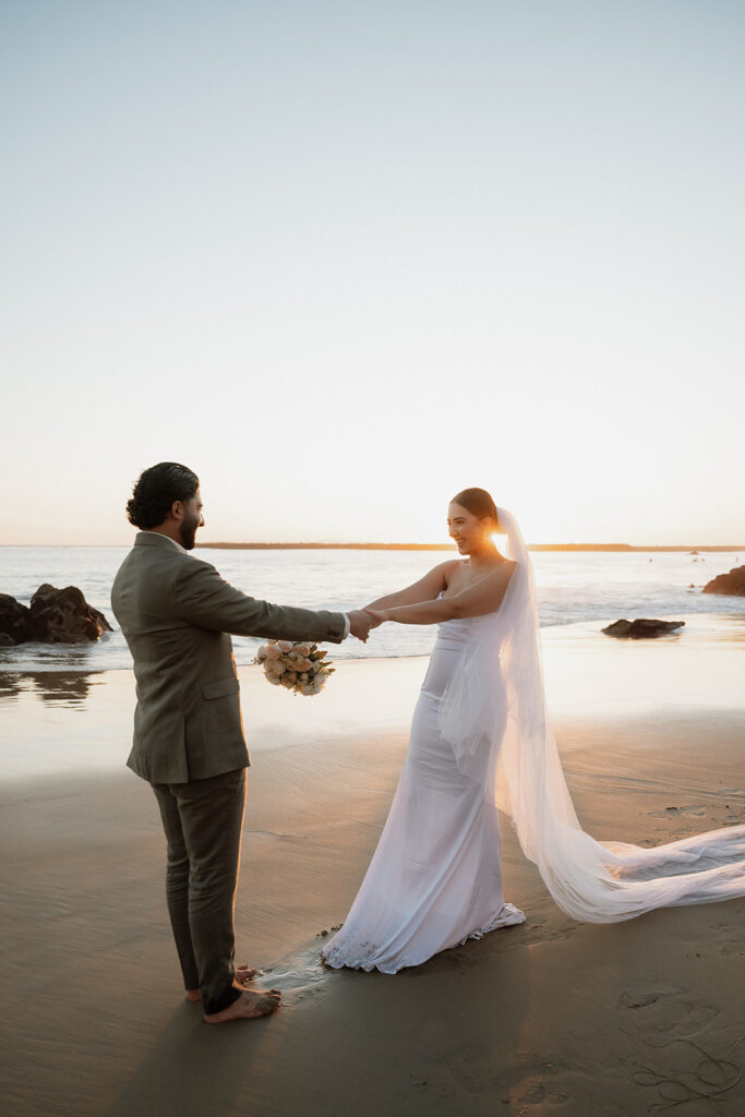 cute picture of the bride and groom dancing in newport beach 