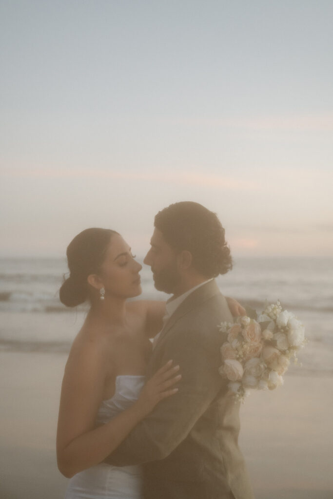 bride and groom smiling at each other