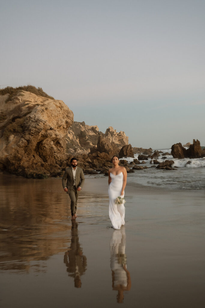 couple running in newport beach during their photoshoot