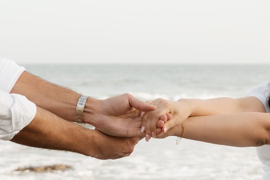 couple holding hands during their session