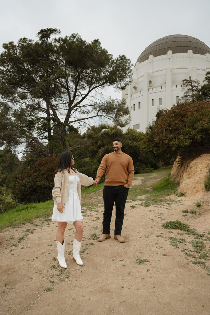 cute couple holding hands during their photoshoot
