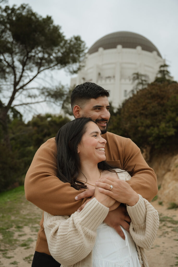 newly engaged couple hugging during their photoshoot in LA