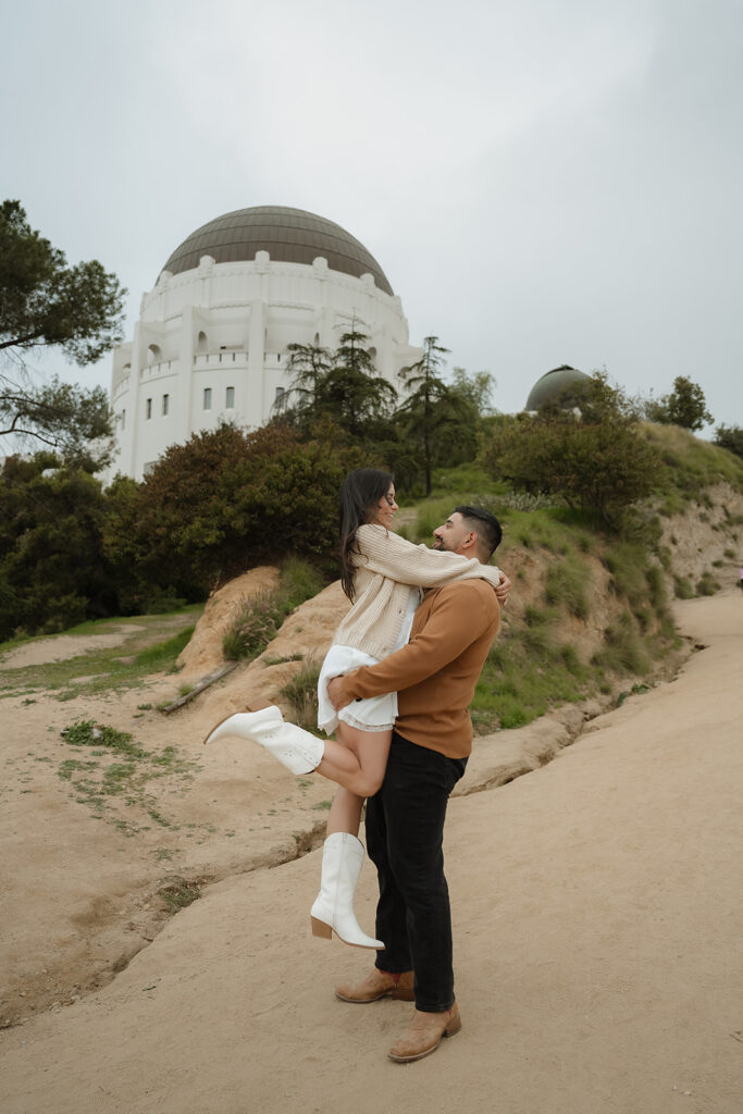 newly engaged couple dancing during their session