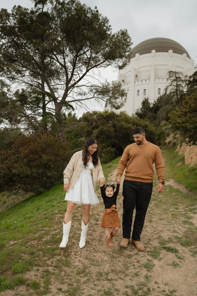 cute couple at their dream engagement photoshoot with their daughter