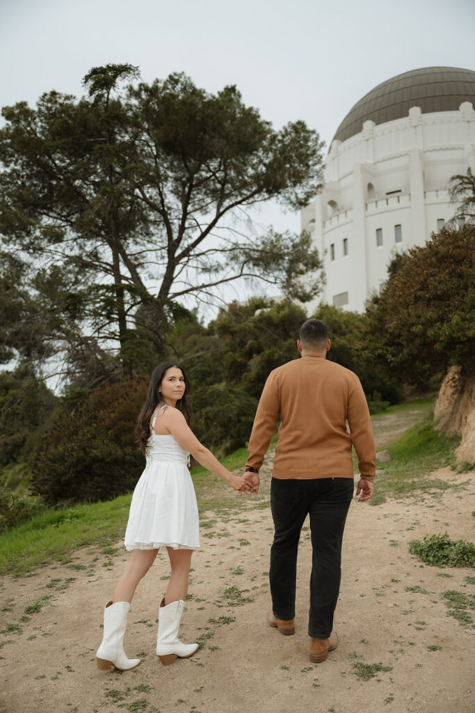 couple walking around their engagement photoshoot location
