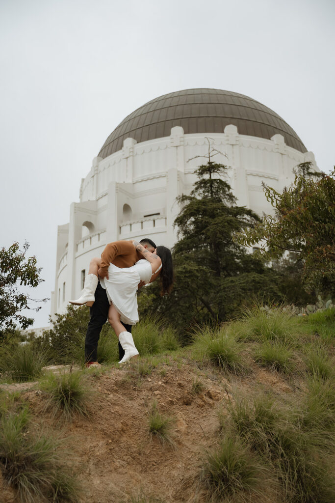 newly engaged couple kissing during their photoshoot