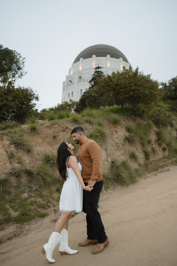 couple looking and smiling at each other during their photoshoot
