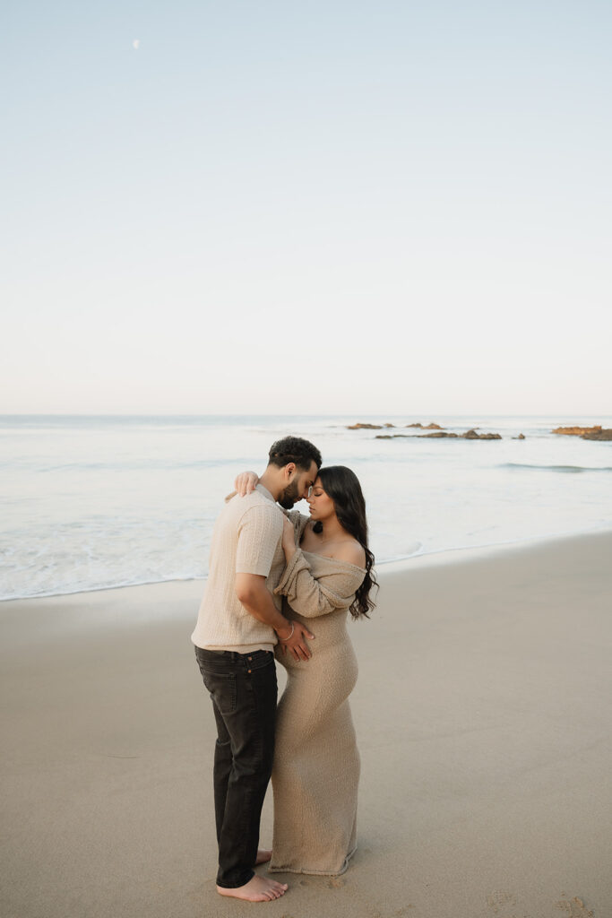 couple kissing during their laguna beach photos