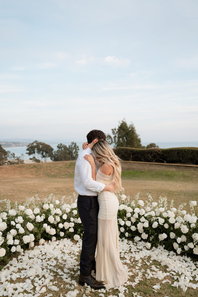 cute picture of the newly engaged couple hugging