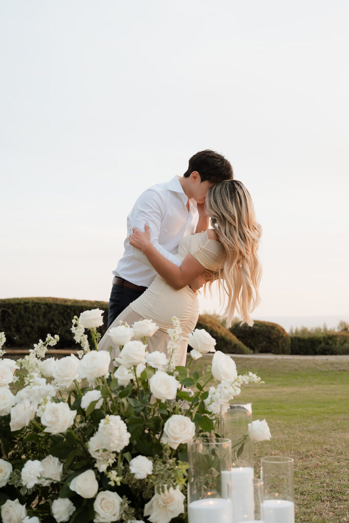 couple smiling at the camera during their photoshoot