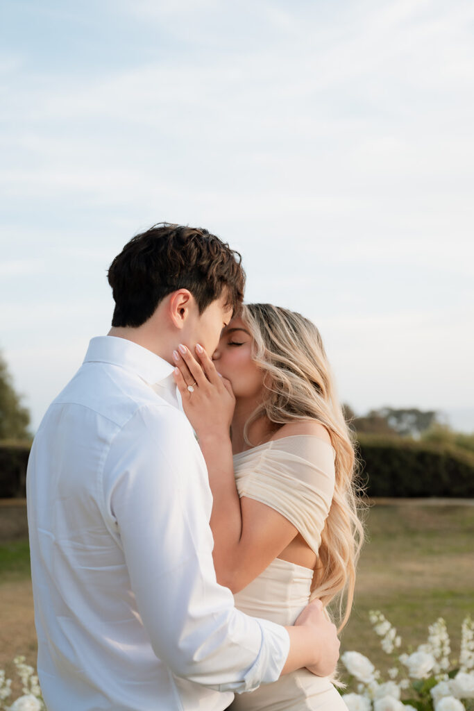 cute couple kissing at their proposal