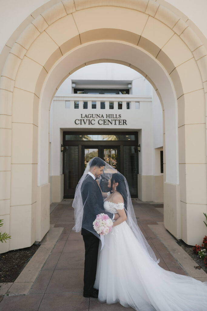 cute portrait of the bride and groom smiling at each other