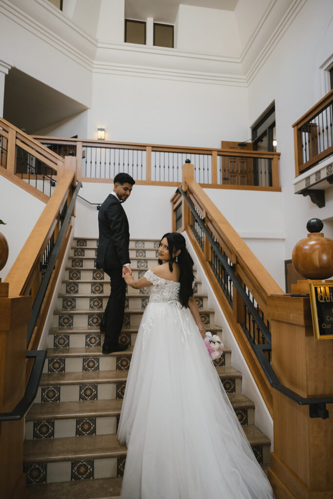 picture of the bride and groom holding hands