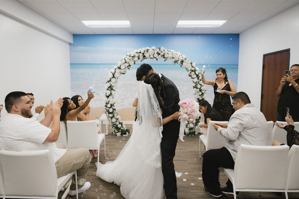 picture of the newlyweds kissing after their ceremony