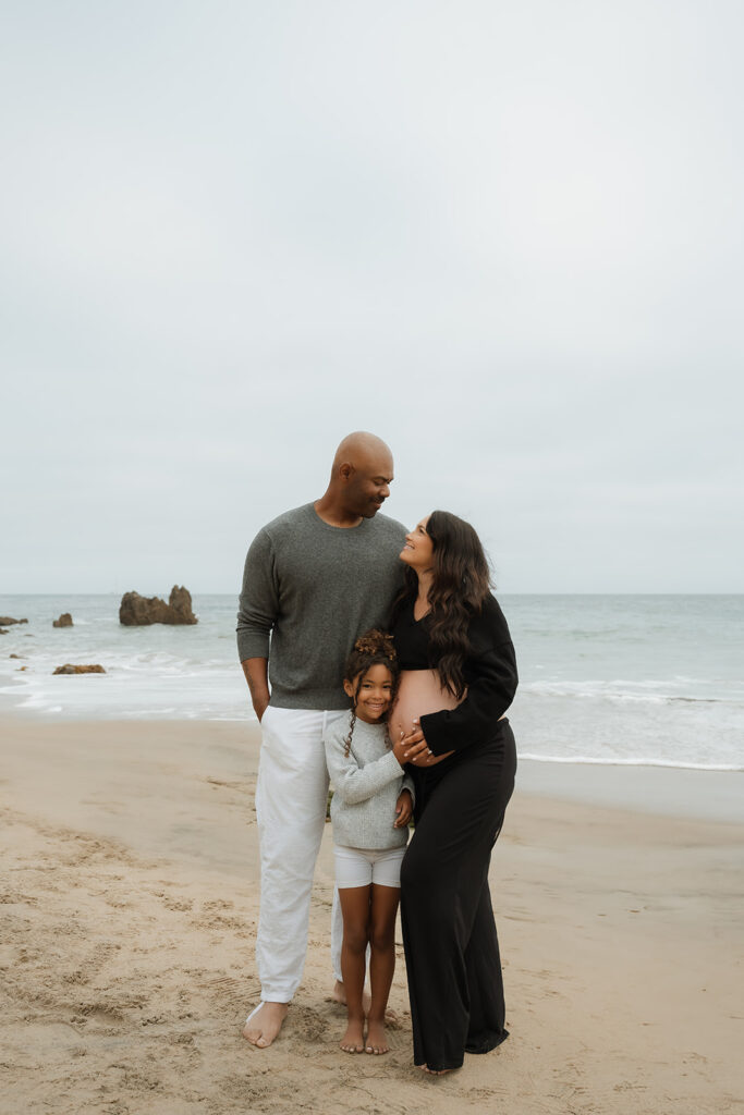 This Cloudy Beach Maternity Shoot Proves Gloomy Days Are Golden