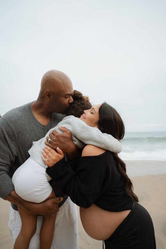 This Cloudy Beach Maternity Shoot Proves Gloomy Days Are Golden