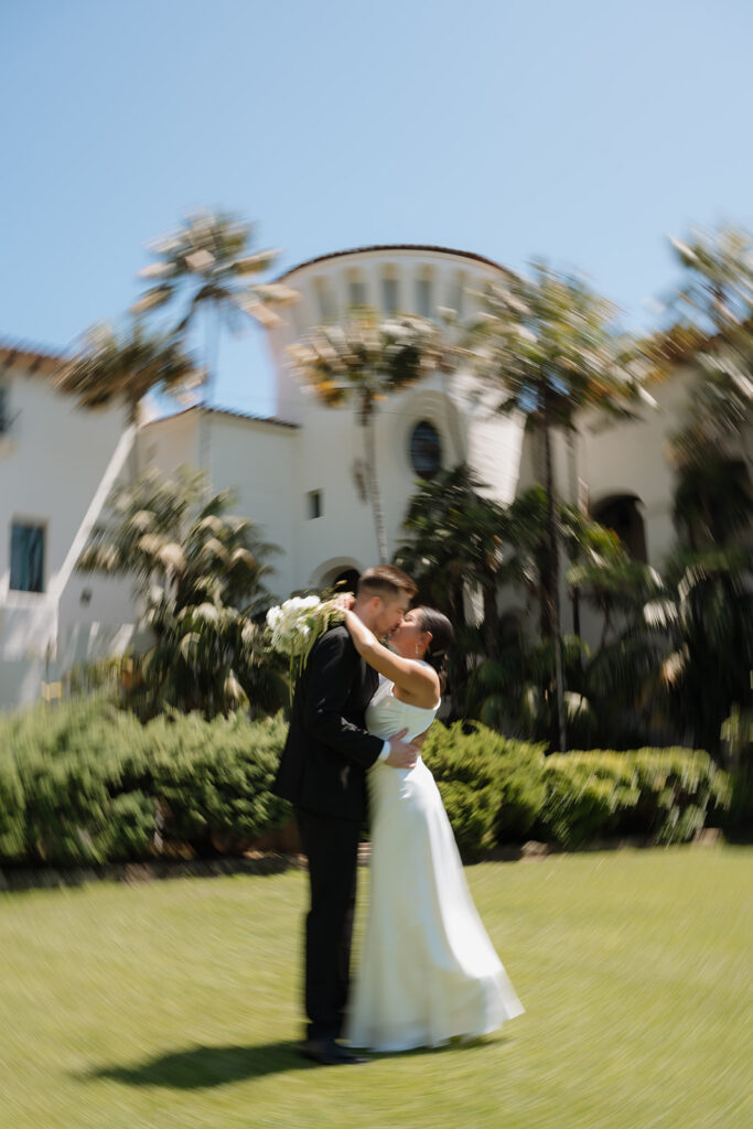 cute picture of the bride and groom kissing