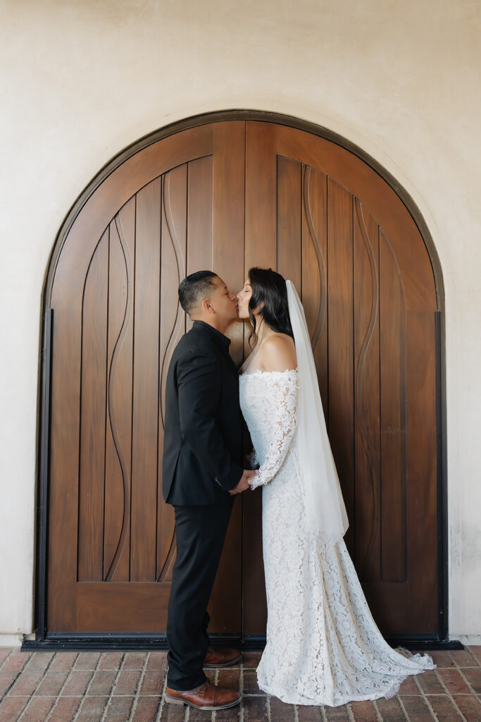 cute picture of the newlyweds kissing
