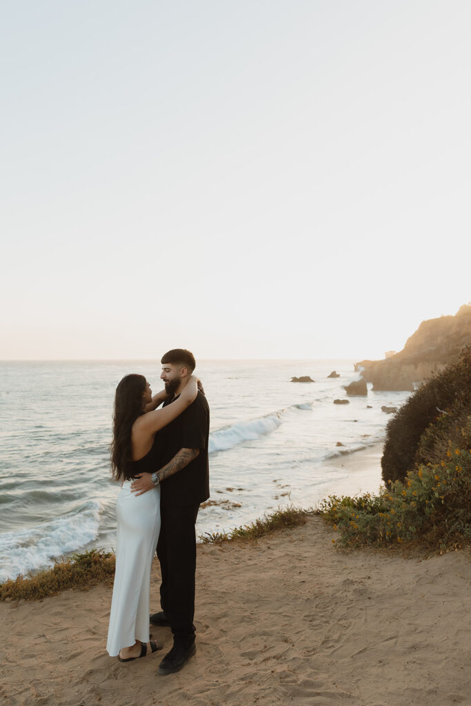 picture of the newly engaged couple at their dram beach photoshoot