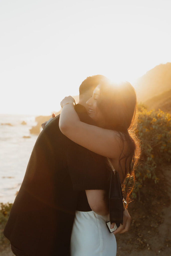 cute picture of the newly engaged couple hugging