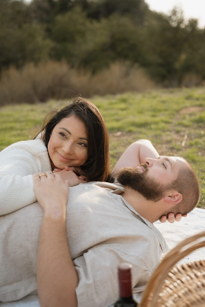 Couple smiling at each other during their session