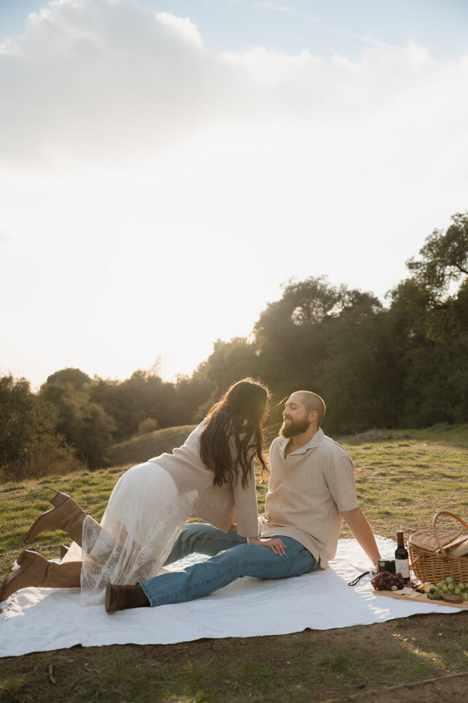Cute picture of the newly engaged, couple kissing